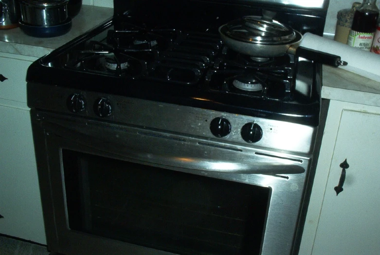 a stainless steel gas stove in a kitchen