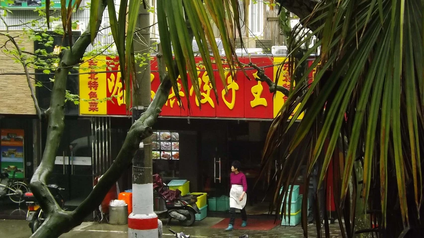 an asian street with several stores on both sides