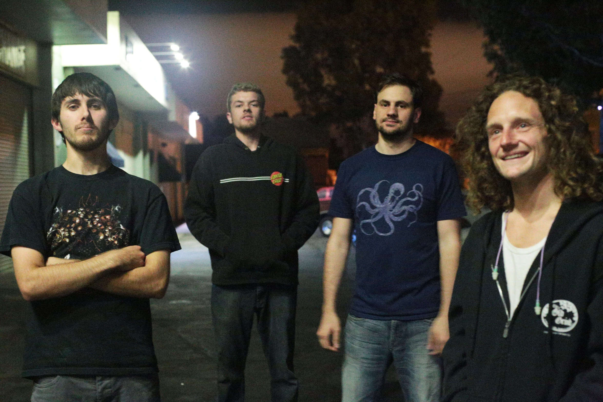 a group of young men are standing together