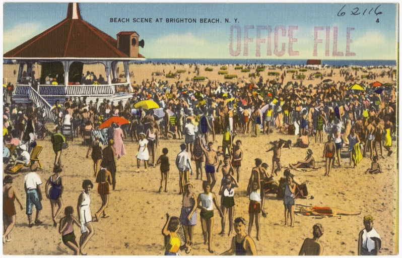 a crowded beach with several people standing and sitting