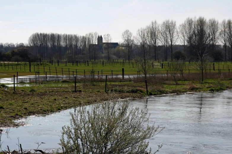 a po of some small pond with fenced in land around it