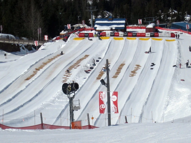 snow covered slopes near an entrance to a ski slope