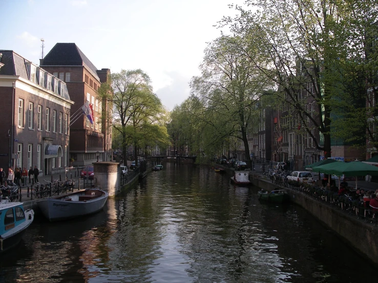 several boats that are docked in a canal