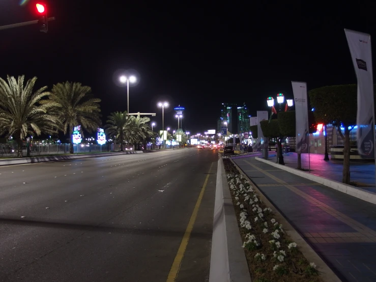 an empty city street with a red light