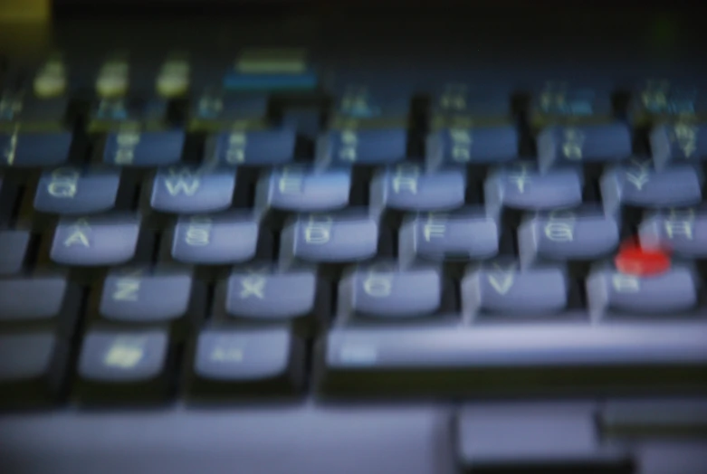 a close up of a keyboard with blurry keys