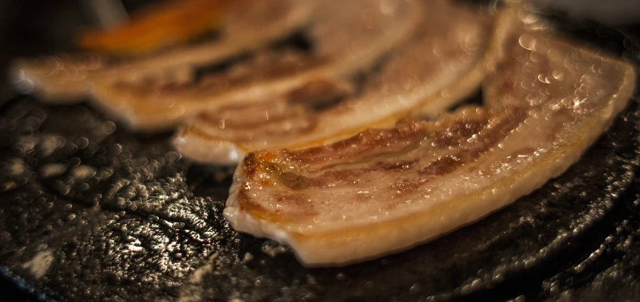 sliced bananas sitting in an oil pan