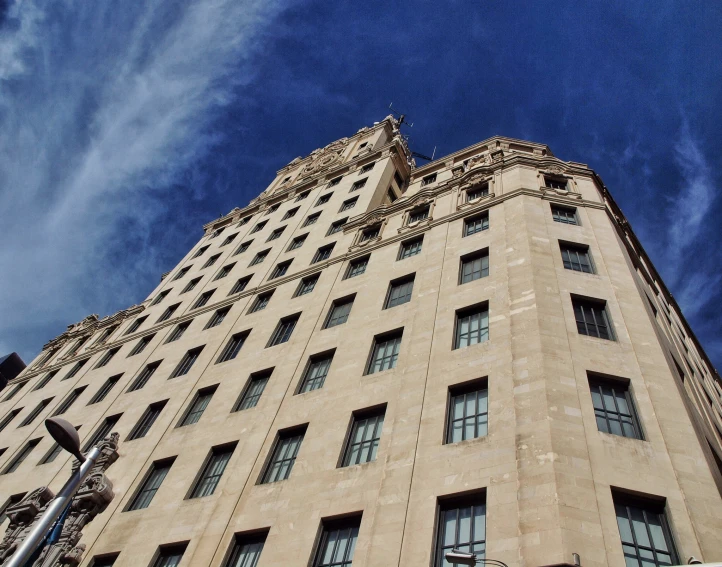 a very tall building with a very blue sky in the background