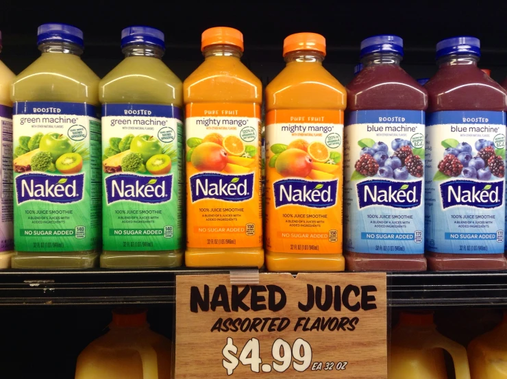 bottles of  juice are stacked on a shelf