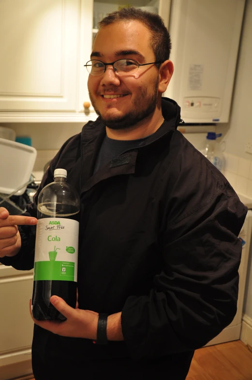 a man holding a water bottle in his hand