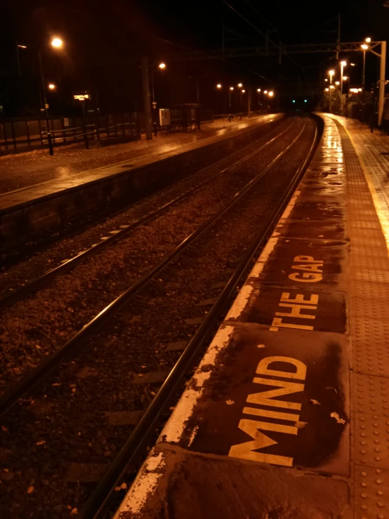 two trains tracks with words on it next to each other