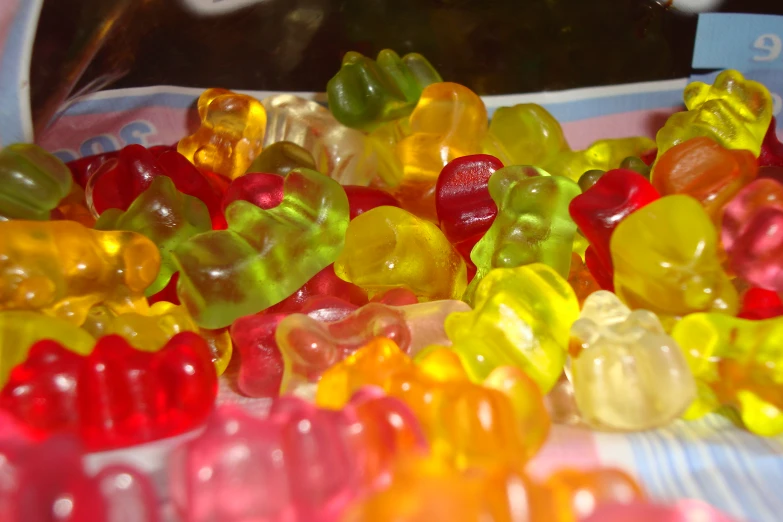 a lot of gummy bears are lying next to each other