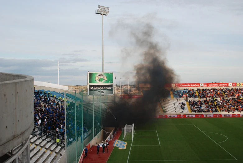 an image of a large soccer stadium fire