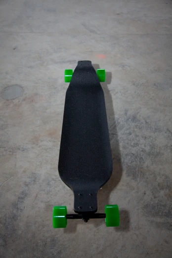 a skateboard is seen standing upright on the concrete