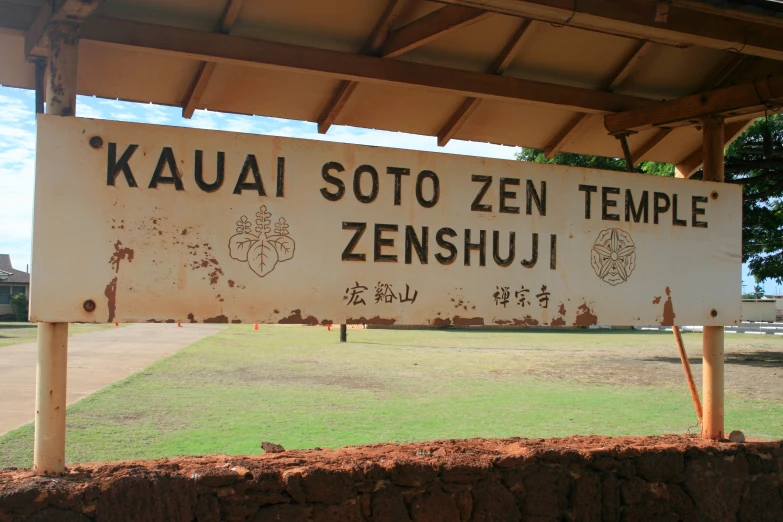 a sign showing the name and symbols on it