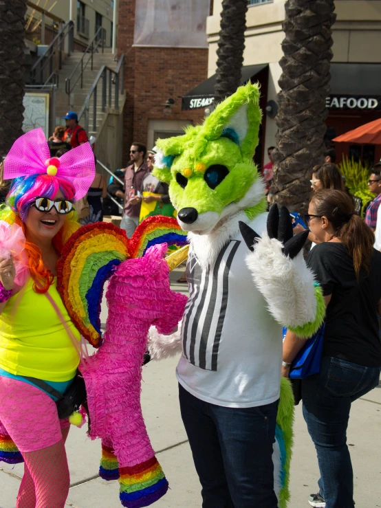 a pair of colorfully dressed people are standing on the street