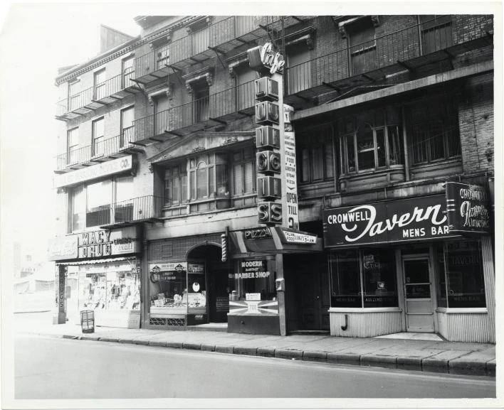 some stores on a corner by a building