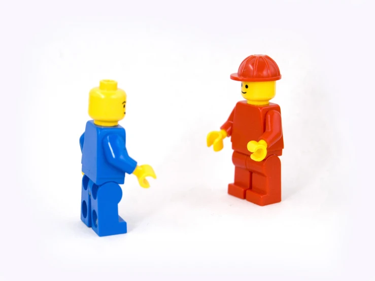 two lego figures with a red one and blue one