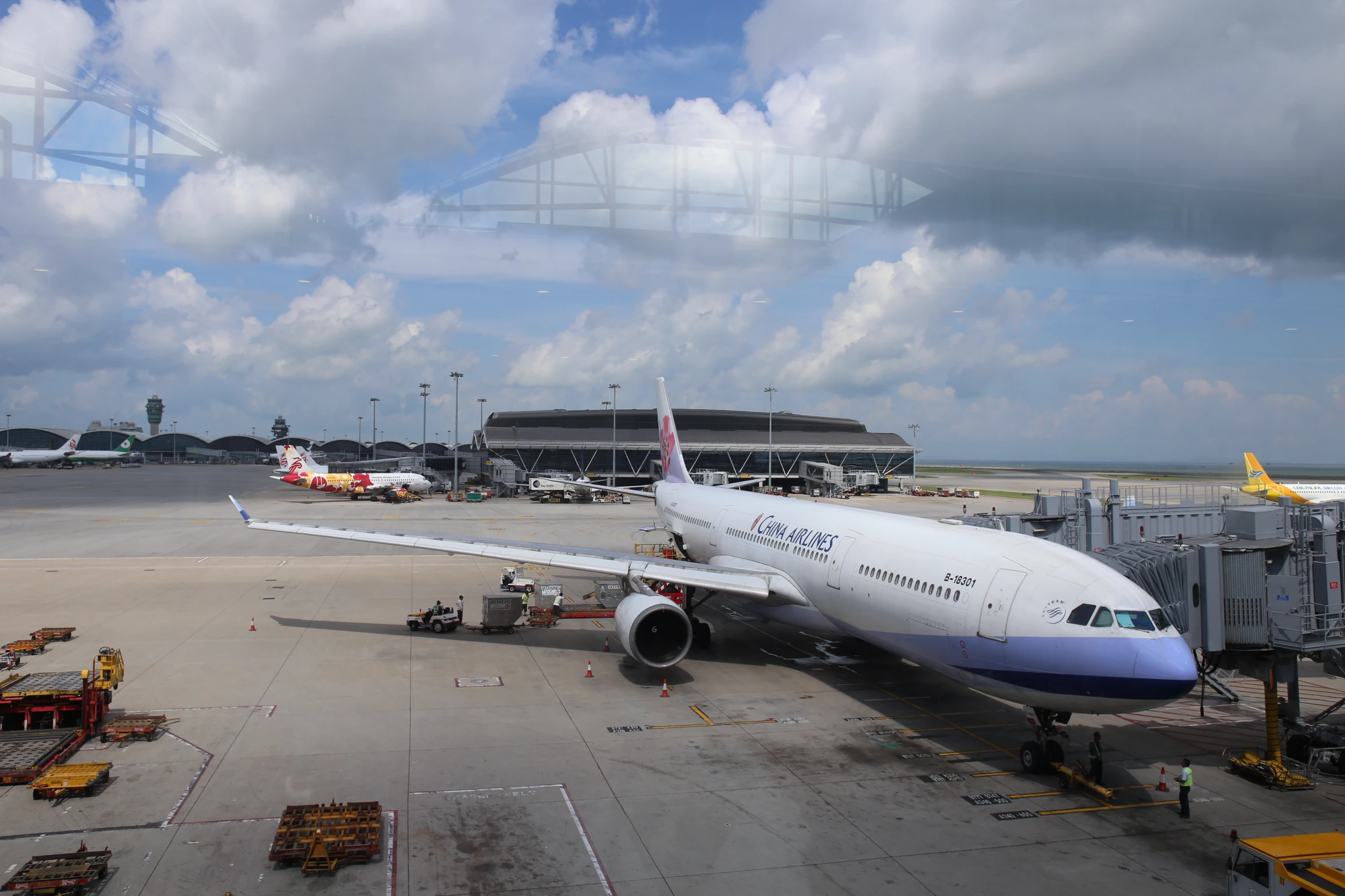 an airplane sits on the tarmac at an airport