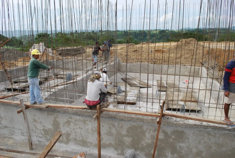 a construction site with concrete being poured around