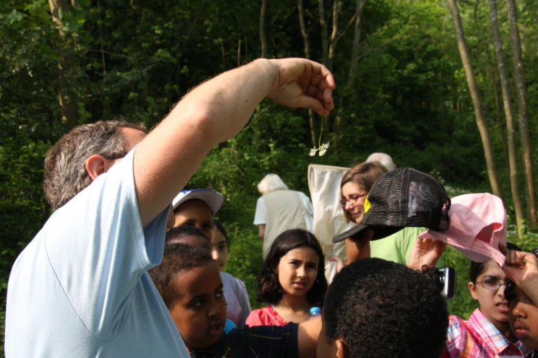 a man pointing at a string on a string