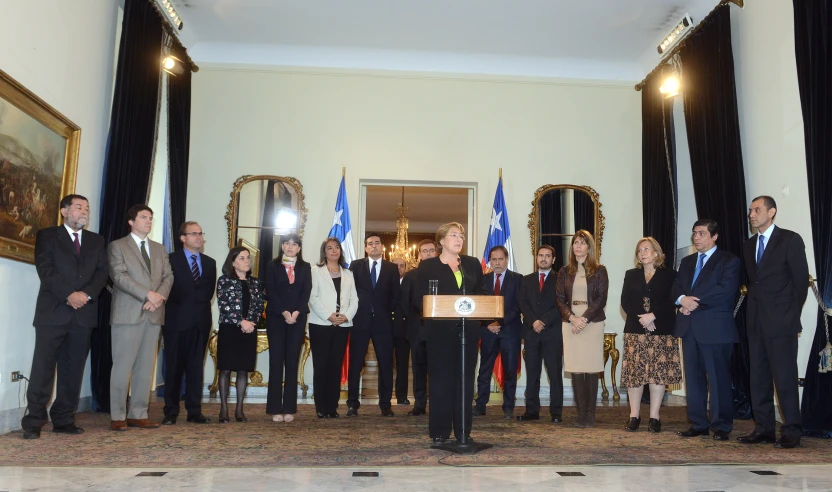 a group of people standing around in a room