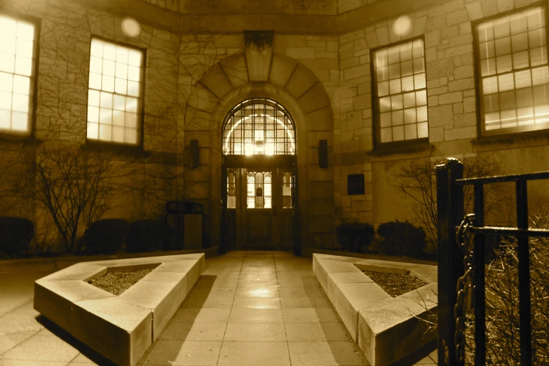 an open door with benches in front of it