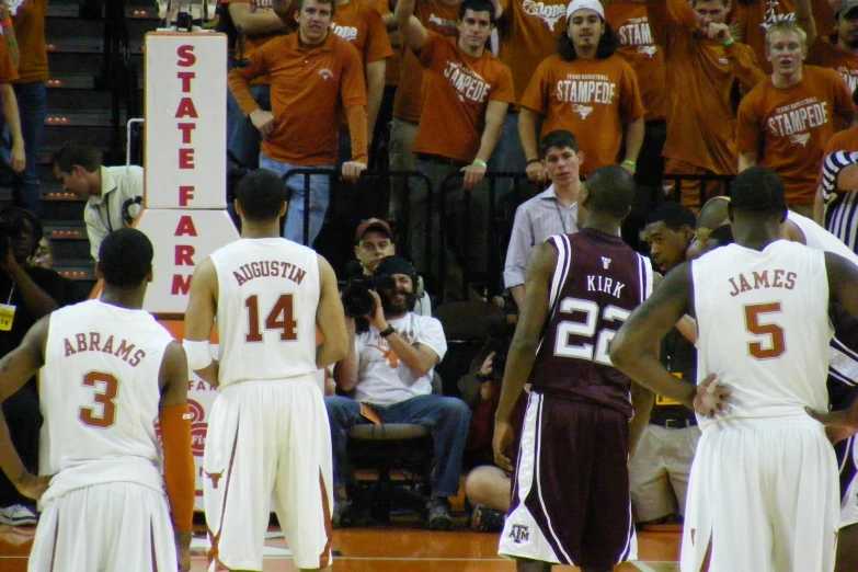 several young men on an indoor basketball court