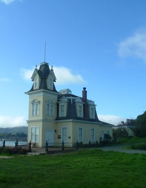 a very pretty big pretty house with lots of windows