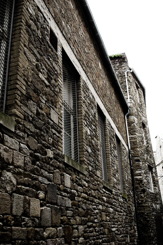 an old brick building next to another building