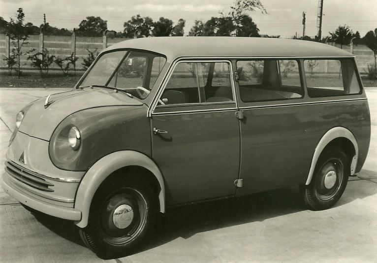 black and white image of a vintage station wagon