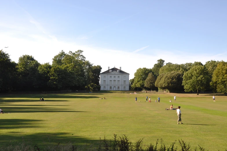 a group of people playing baseball in a field