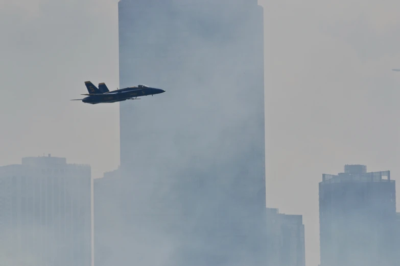 a fighter jet flying through a cloudy city