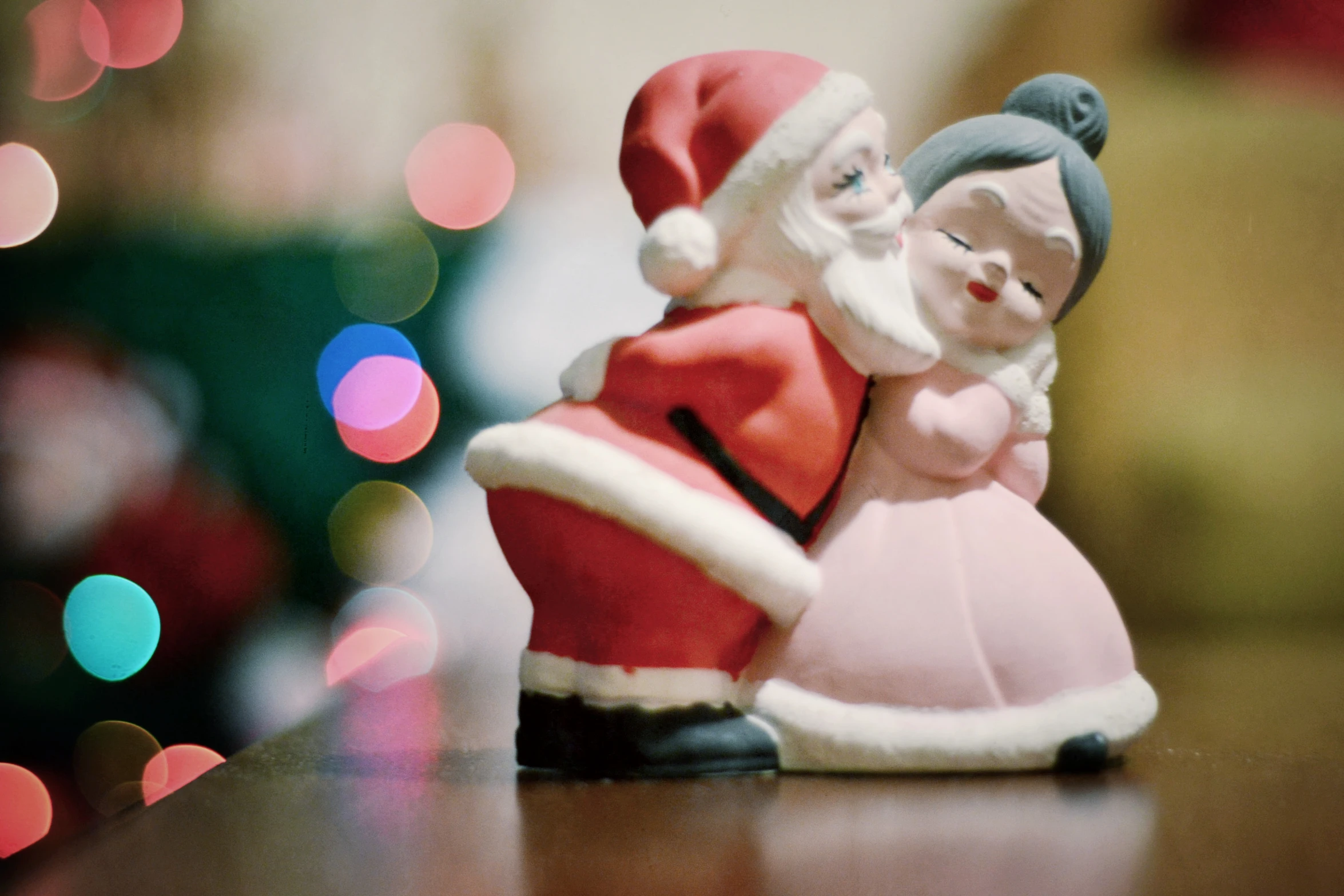 a christmas scene made of a toy santa and his little girl