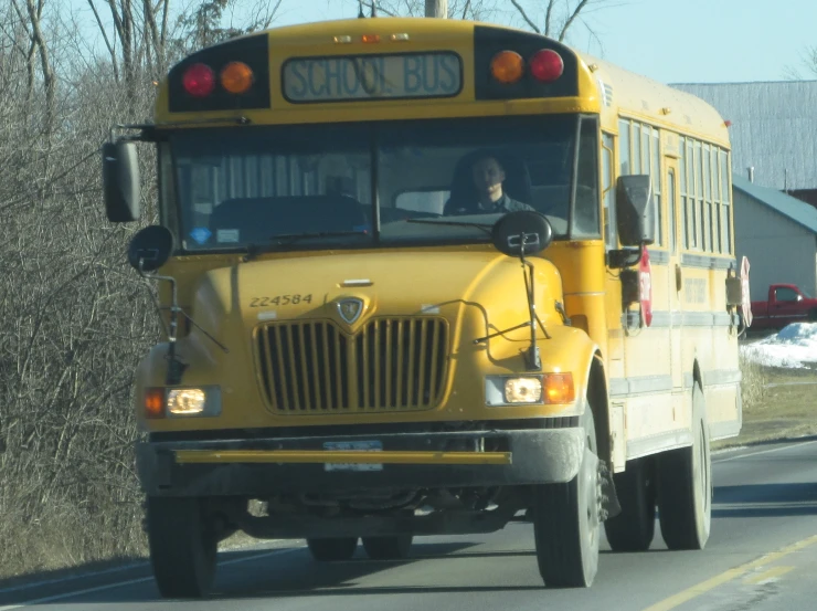 a school bus that is driving down the street