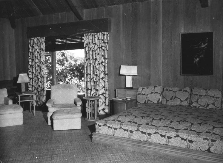 black and white po of living room with couches and chairs