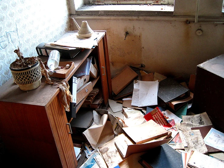 debris and broken paper scattered around the living room