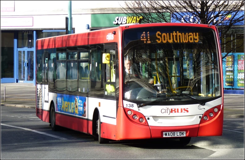 a bus is in the middle of a street