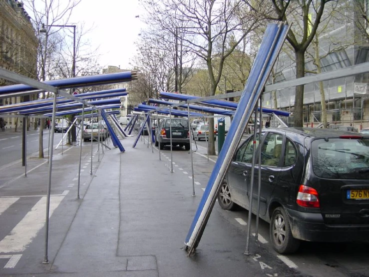 a blue and chrome structure sitting in the middle of a street