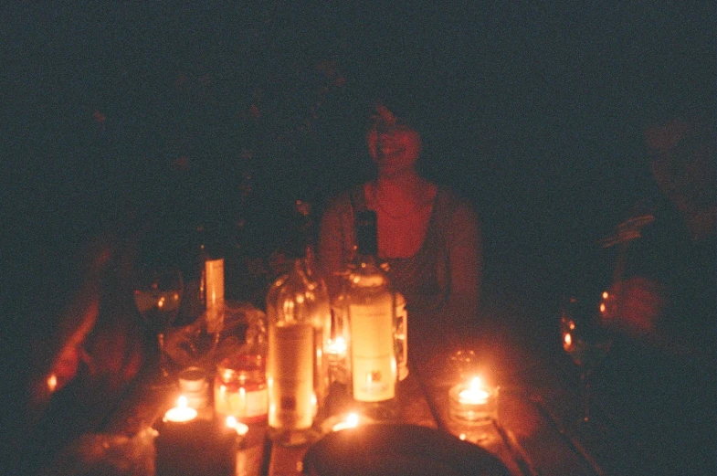 a candle display on the ground covered in candles