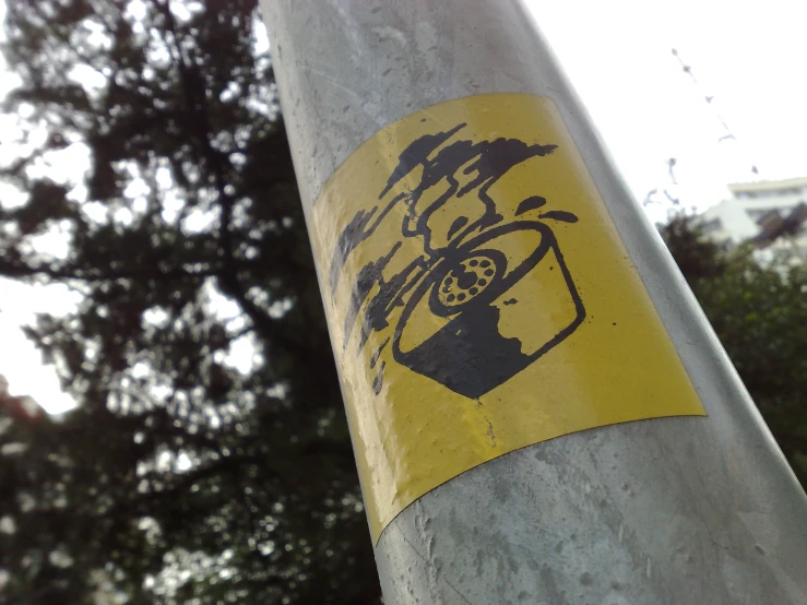 a traffic sign posted to a pole on the street