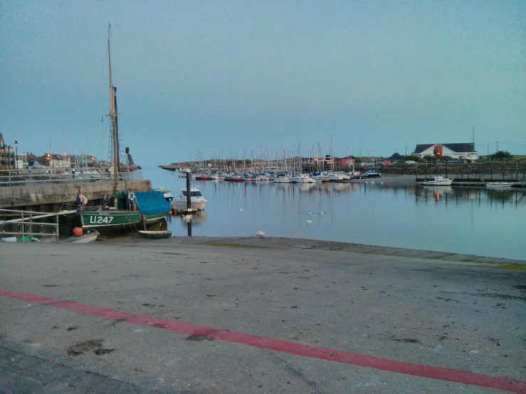 several boats are docked at a marina