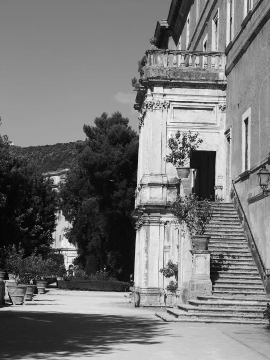 a long stone stairway with stairs leading to the top