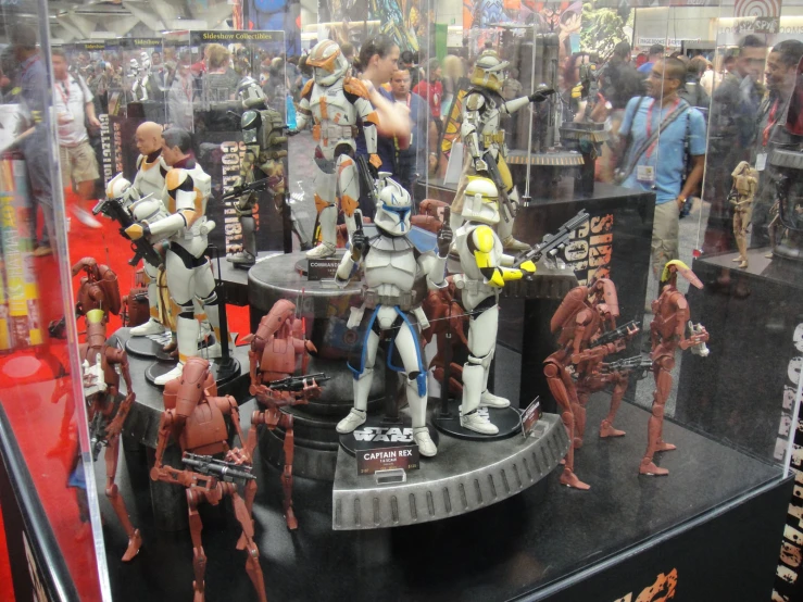 star wars action figures in display case at convention