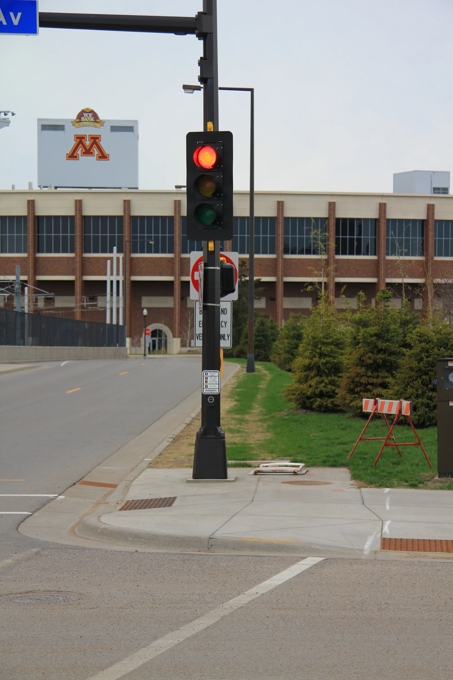 a traffic light sits at the corner of a street