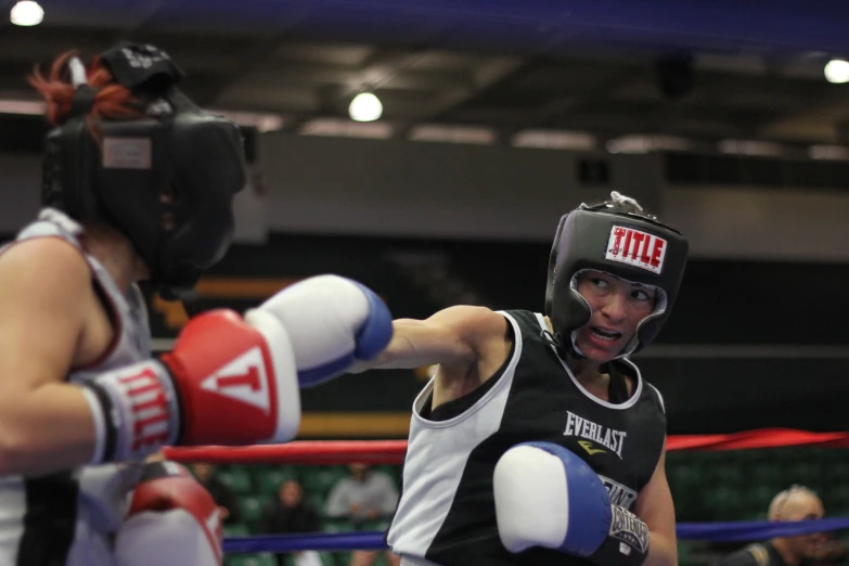 a young man with boxing gloves on getting ready to punch another