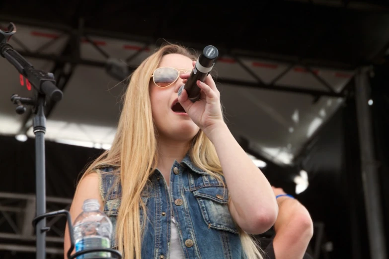 a woman looking into a telescope at an event