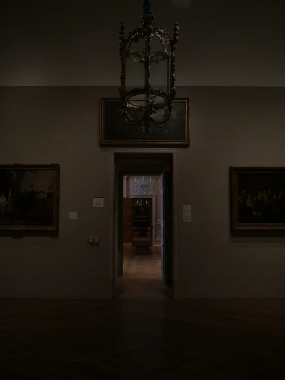 the front hall with a clock and paintings