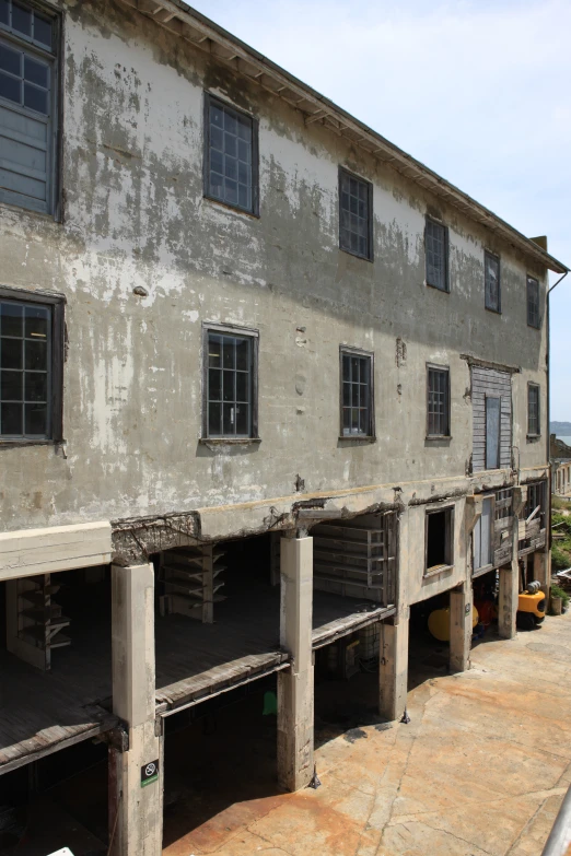 an apartment building is being constructed on a dirt lot