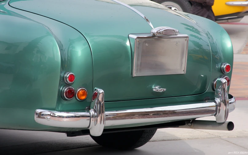 the rear end of an old vintage car