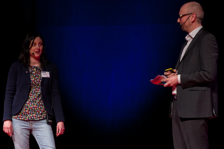 a man and a woman talking to each other